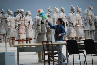 woman dusting warrior